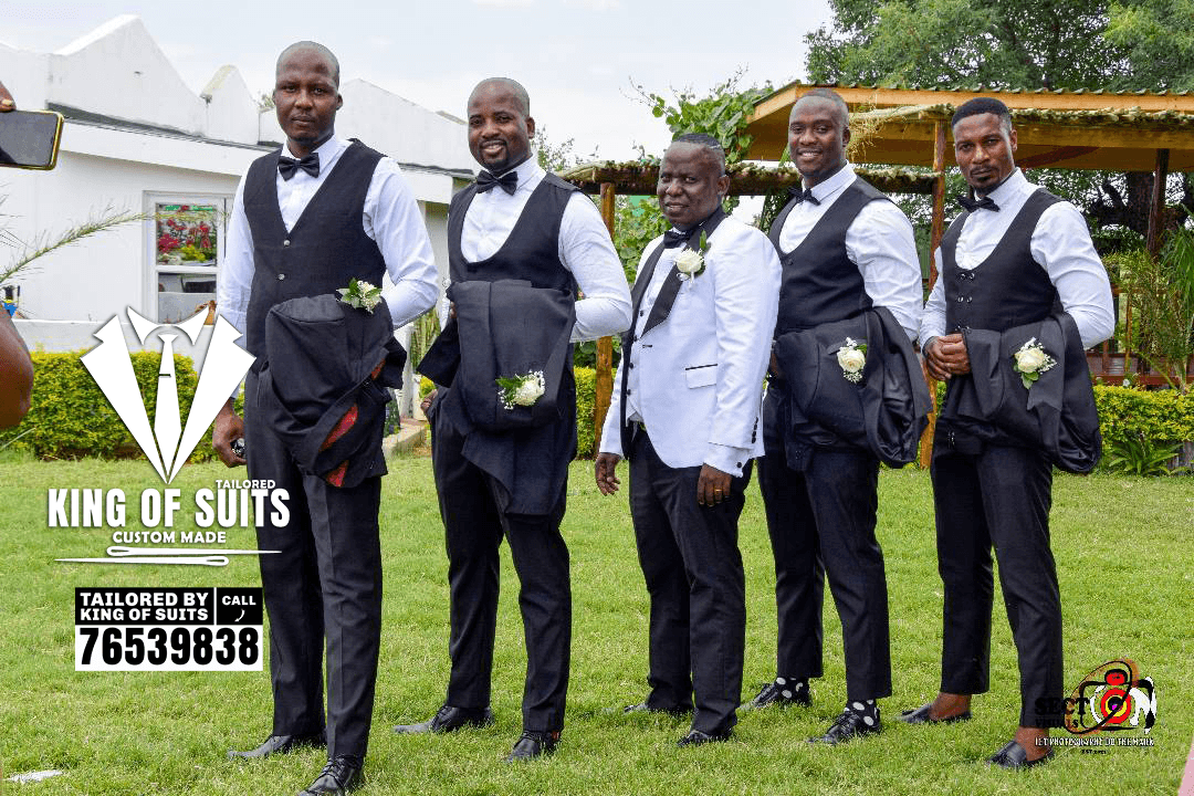 Groomsmen wearing formal waistcoats and bow ties